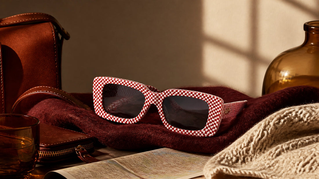 Aderiyike red lattice sunglasses styled with burgundy wool, tobacco leather and amber glass for A/W 2026